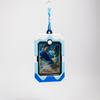 A blue and white rugged protective card holder or game case with a keychain attachment, featuring a screen showing a colorful card illustration, set against a light gray background.