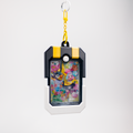 A Pokémon-themed card holder keychain featuring a colorful Lavender and Misty character card inside a black and yellow protective frame, suspended from a yellow keychain ring on a light gray background.